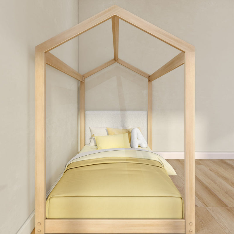 Natural wood house-frame kids bed, pale yellow bedding and plush letter pillow in minimalist children's bedroom