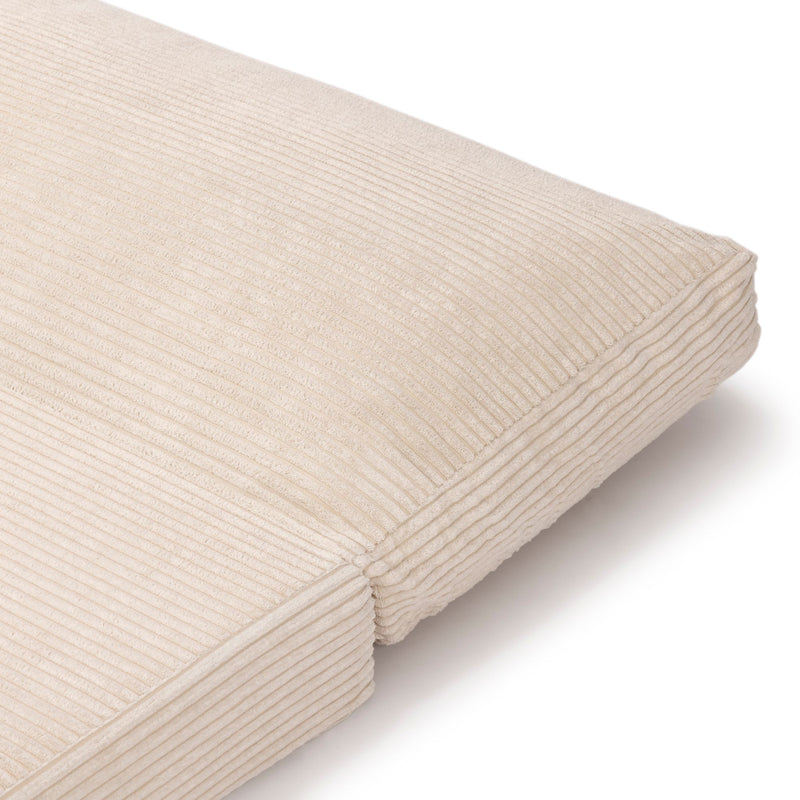 Beige corduroy lumbar pillow with horizontal ribbed texture and piped edges, soft decorative sofa cushion for living room