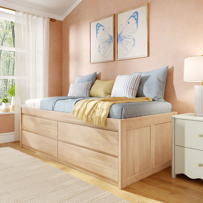 Cozy modern bedroom with light wood storage daybed, pastel blue and yellow pillows, striped cushions, butterfly wall art and sheer curtains letting in natural light