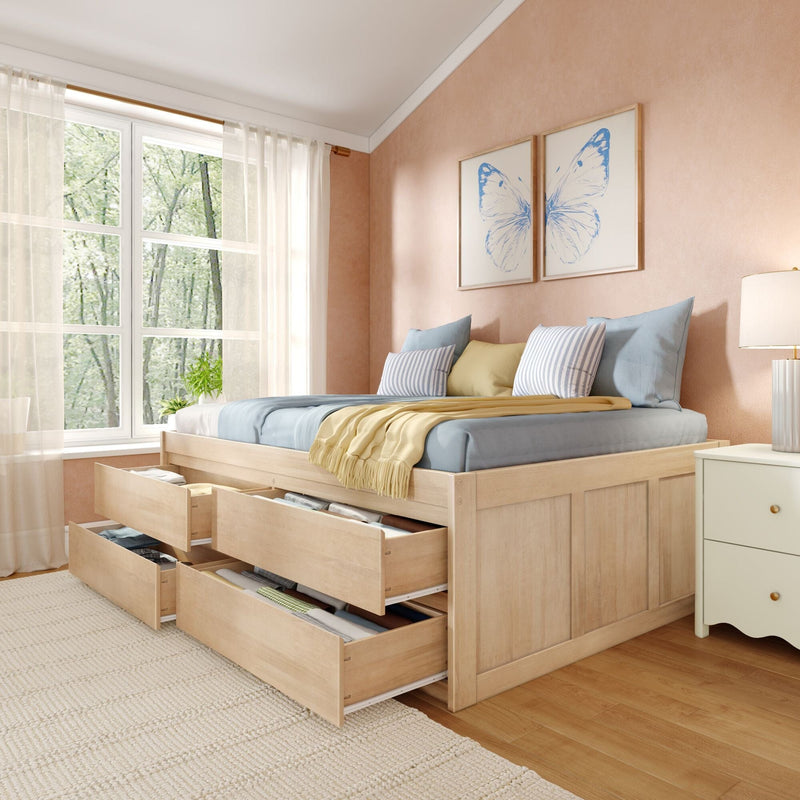Wooden storage bed with drawers in a light-filled cozy bedroom, pastel blue and yellow bedding, sheer curtains and butterfly wall art
