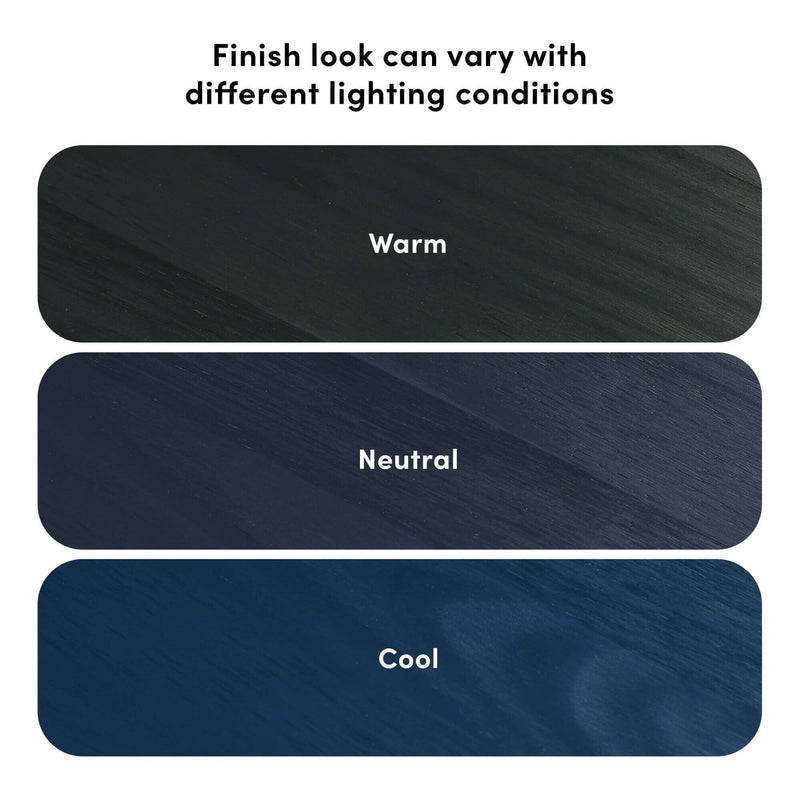 Three rounded wood finish sample swatches labeled Warm, Neutral, Cool under the heading “Finish look can vary with different lighting conditions,” showing charcoal, navy and deep-blue tone variations for wood finishes