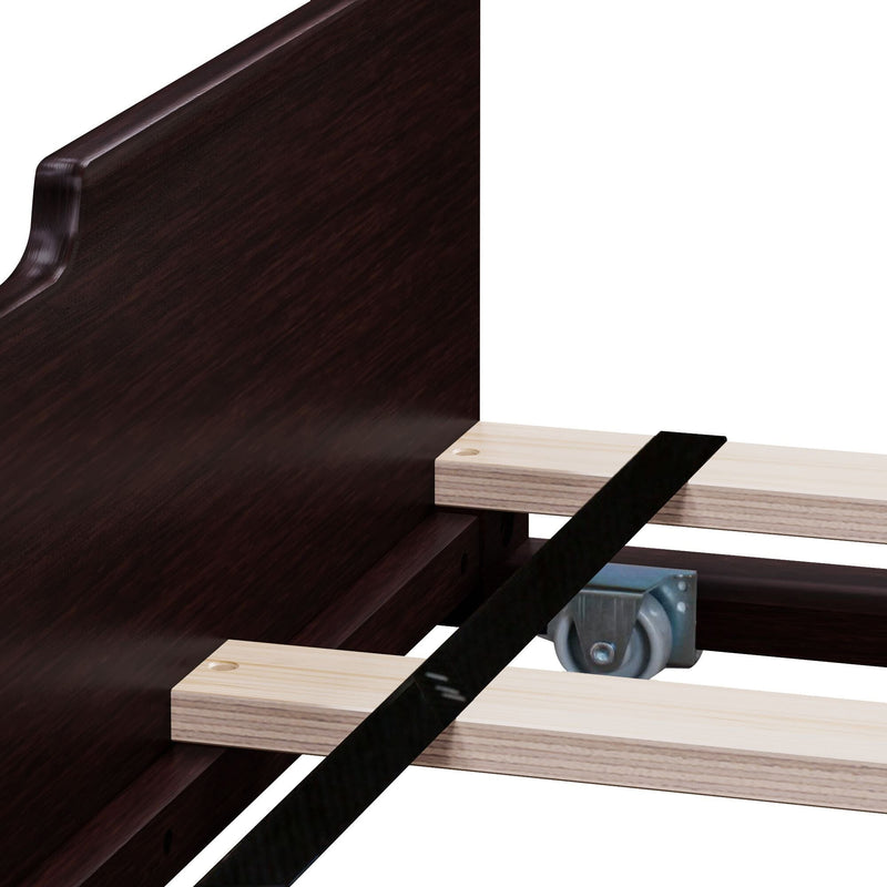 Close-up of espresso wood bed frame headboard with light pine slats, black center support strap and metal caster wheel