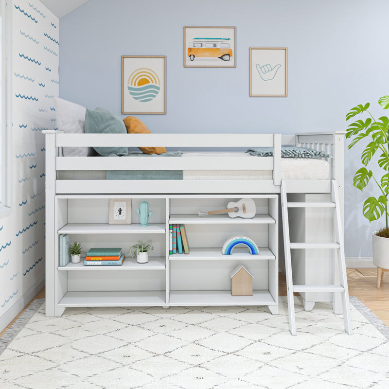 White kids loft bed with built-in storage shelves and ladder in a coastal-themed nursery — light blue walls, framed surf and sunset wall art, pastel pillows, toys and plants.
