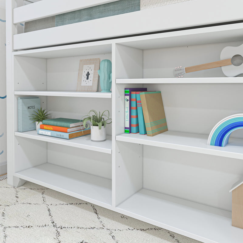 White built-in shelving under loft bed in kids' bedroom with colorful books, potted plants, cactus figurine, ukulele and rainbow toy