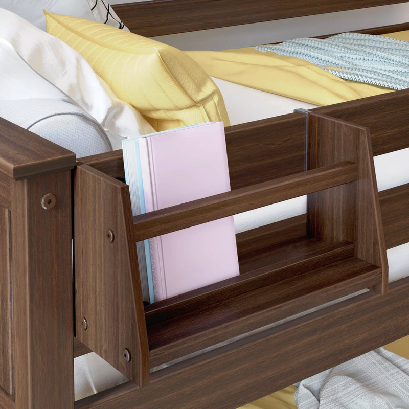 Dark walnut bed frame with built-in side bookshelf holding pastel hardcover books, yellow pillow and white bedding — bedside storage solution