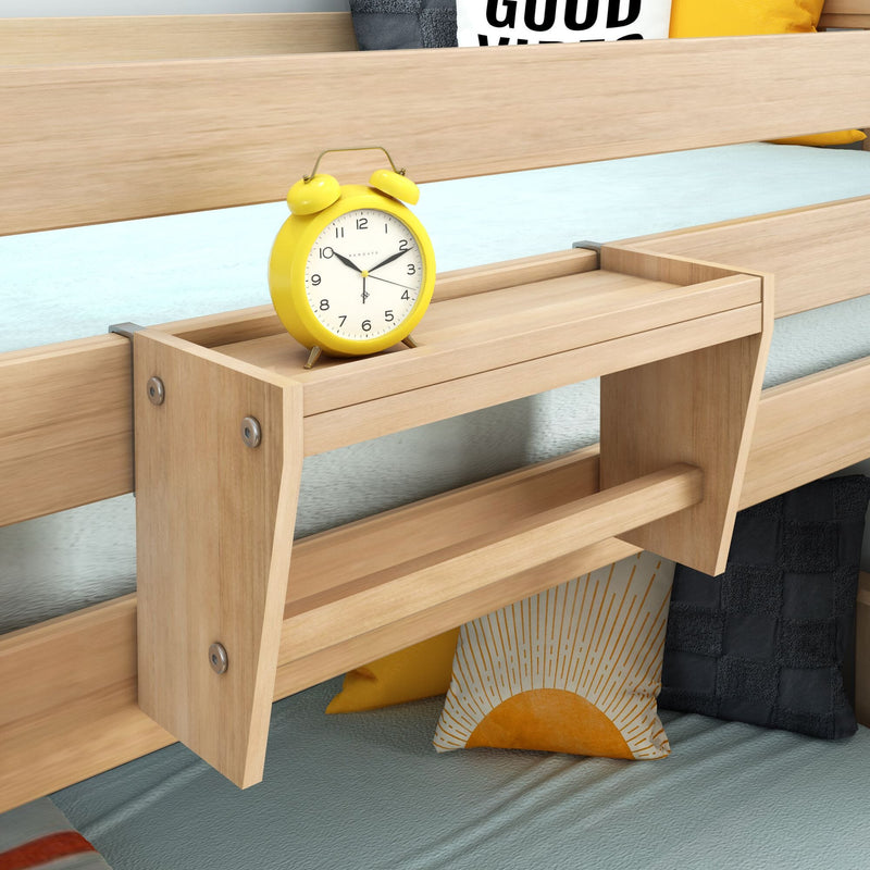 Wooden bunk bed with built-in bedside shelf, yellow retro alarm clock and sun-print throw pillows on light blue bedding for kids bedroom decor