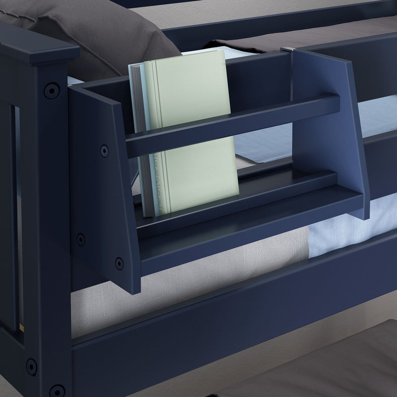 Navy blue wooden bunk bed close-up showing built-in bookshelf holding light-colored books, gray bedding and mattress