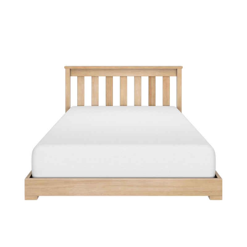 Light oak wooden platform bed with slatted headboard and white mattress, minimalist bedroom furniture