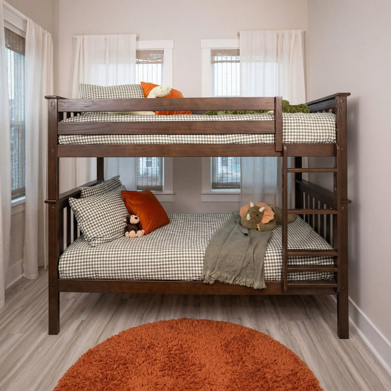 Wooden twin-over-full bunk bed in kids' bedroom with gray gingham bedding, orange accent pillows, plush toys and sheer white curtains
