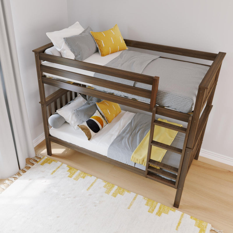 Modern wooden bunk bed with ladder in kids' bedroom, gray and yellow bedding, decorative pillows and cozy knit throw on light wood floor