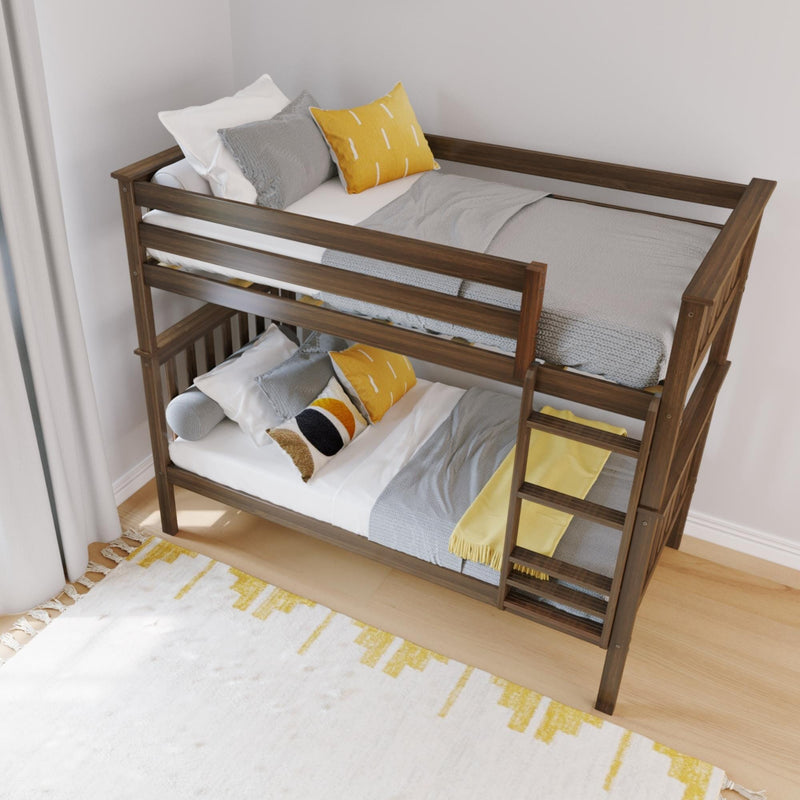 Solid wood bunk bed with ladder and top and bottom bunks, styled with gray knit blankets, white sheets and yellow decorative pillows in a modern kids' bedroom
