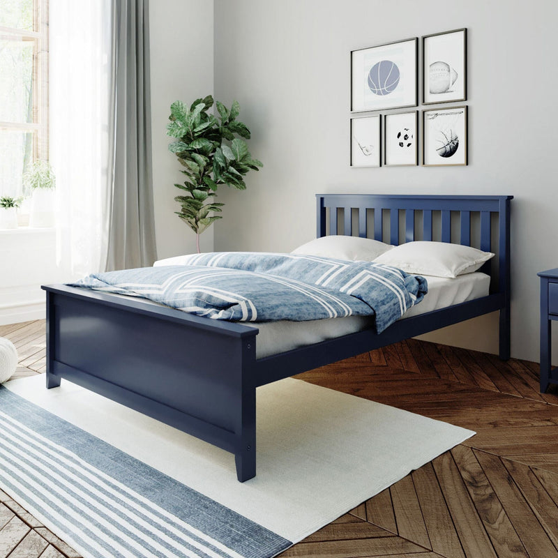 Navy blue wooden bed with blue-and-white striped bedding in modern bedroom featuring sheer curtains, fiddle leaf plant, sports-themed gallery wall and hardwood floors