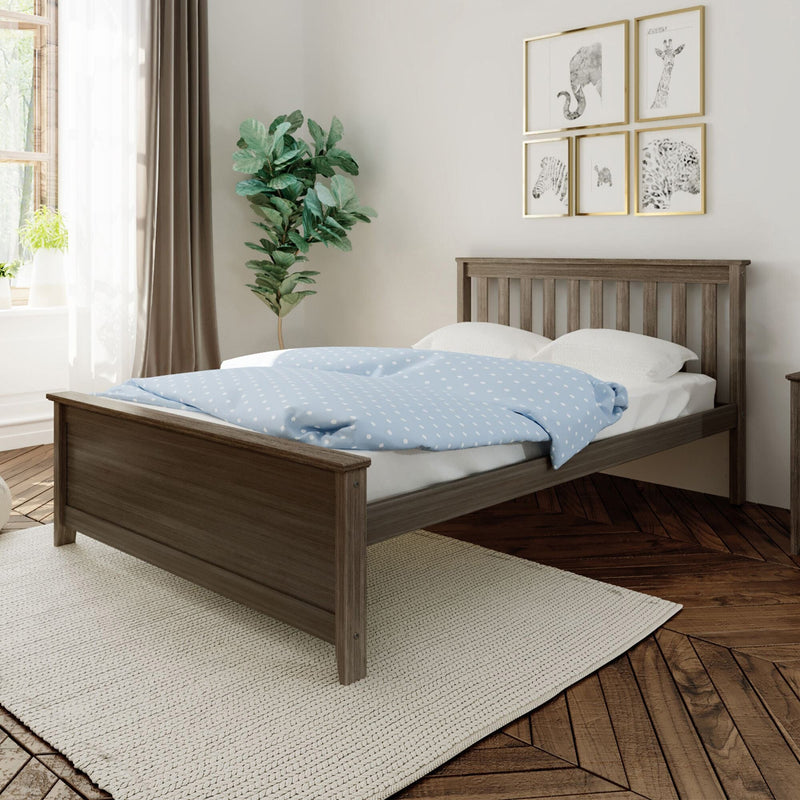Modern bedroom with wooden bed frame, light blue polka-dot duvet, fiddle-leaf fig indoor plant and framed animal wall art by a sunlit window