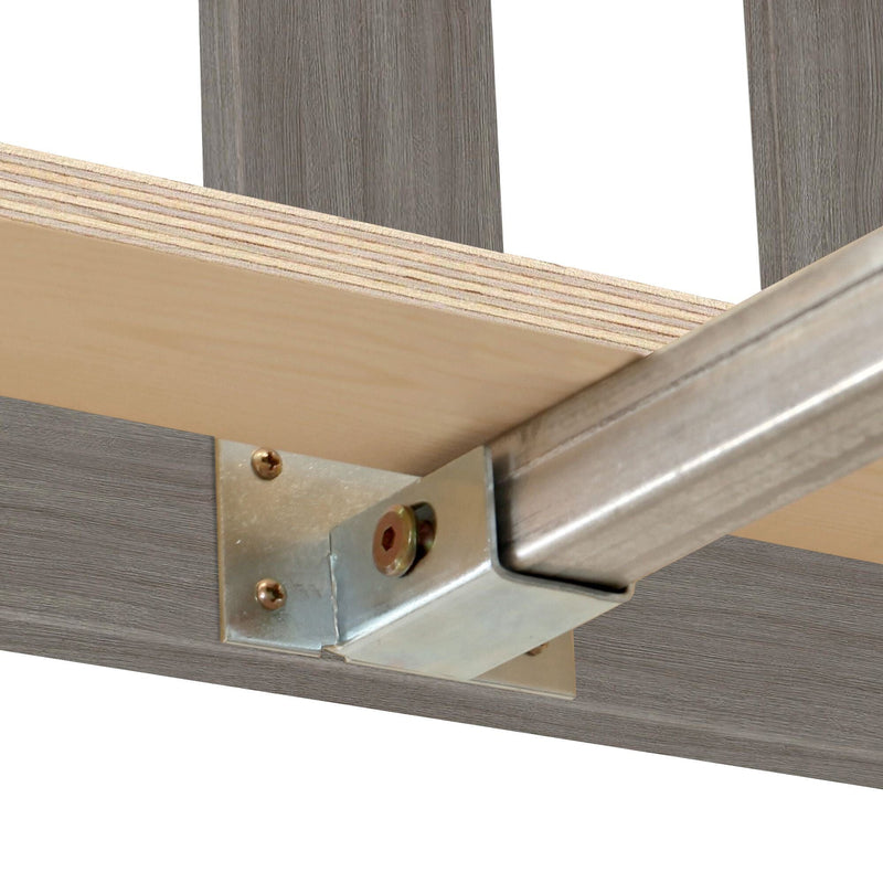 Close-up of heavy-duty metal bracket and steel rail mounting a plywood shelf with bolts — industrial shelving hardware installation
