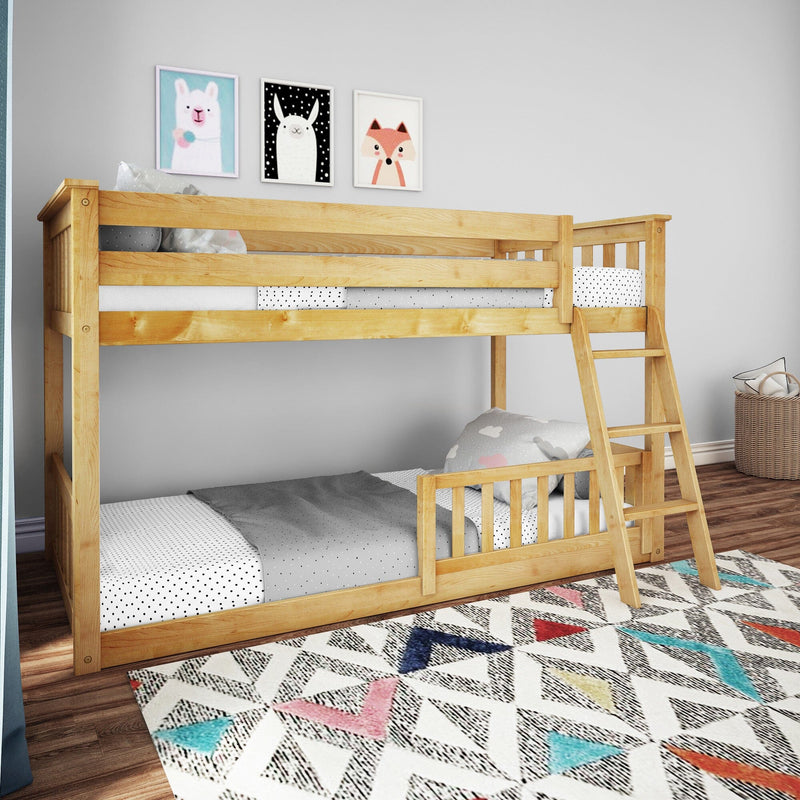 Natural pine twin-over-twin bunk bed with ladder in kids' bedroom, polka-dot bedding and playful animal wall art