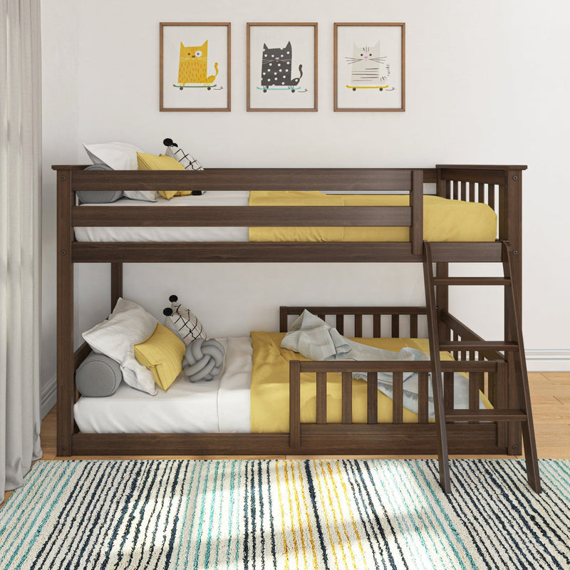 Dark brown wooden twin-over-full bunk bed with ladder, yellow bedding and throw pillows in modern kids' bedroom with cat wall art and striped area rug