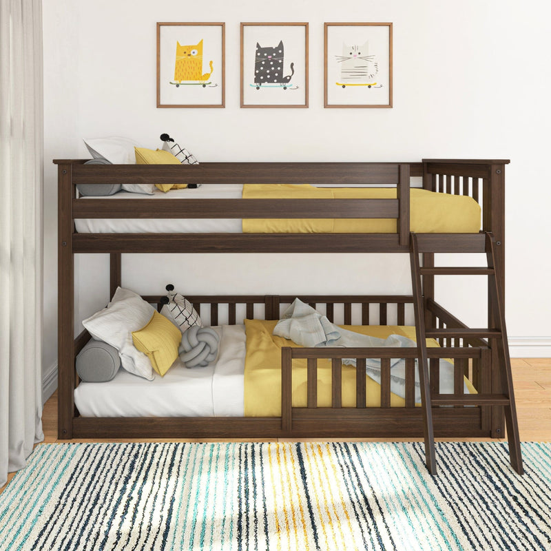 Dark wood twin-over-twin bunk bed with ladder, yellow bedding and safety rails in kids' bedroom with cat wall art and striped area rug