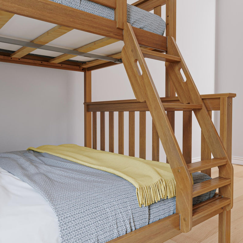 Wooden bunk bed ladder and loft bed close-up with natural wood finish, gray knitted blanket and yellow throw on cozy mattress