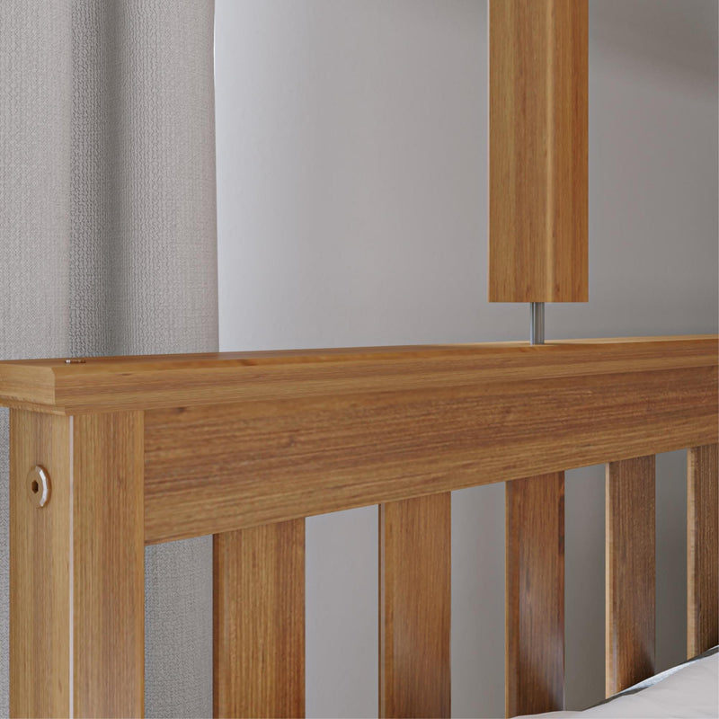 Oak slatted headboard and matching wooden bedside lamp against neutral textured curtains in a minimalist modern bedroom interior