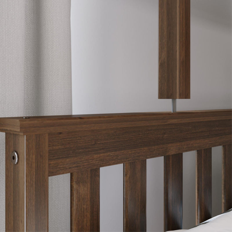 Close-up of dark walnut slatted wooden headboard with textured beige curtain and modern bedside lamp in minimalist bedroom
