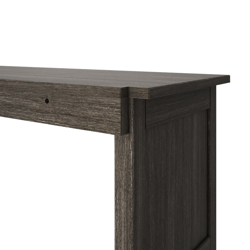 Close-up of dark brown textured wood dresser corner showing top surface, drawer front and wood grain, modern rustic furniture