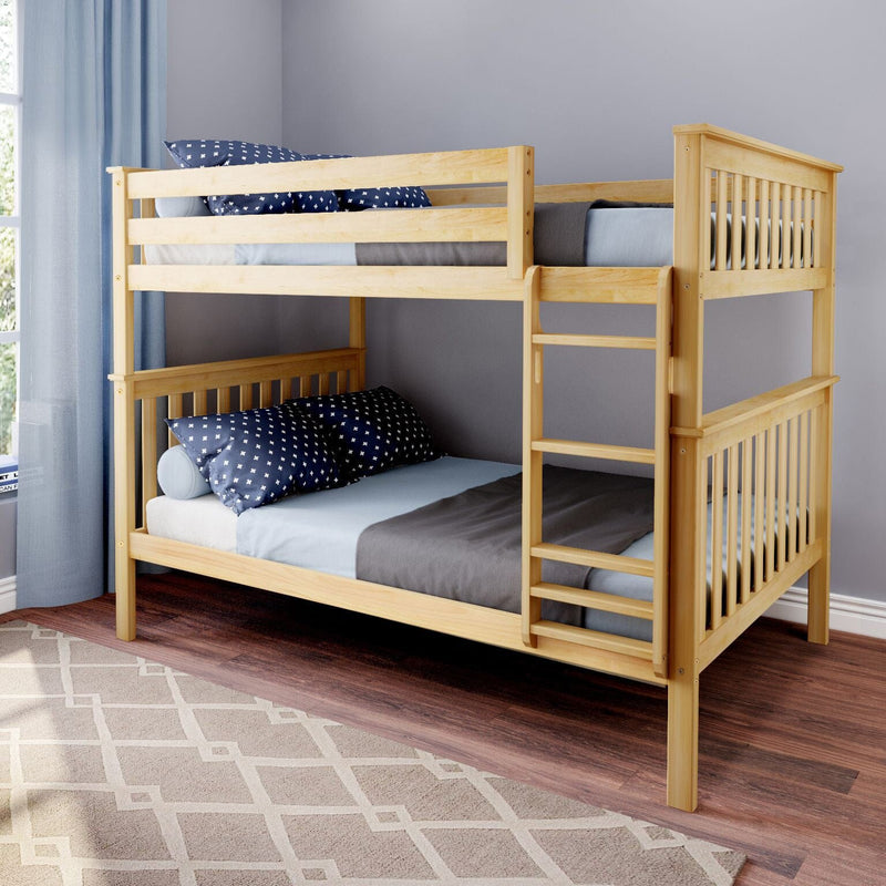 Natural wood twin-over-twin bunk bed with ladder, blue star-patterned pillows and gray bedding in a children's bedroom with hardwood floor and light blue curtains.