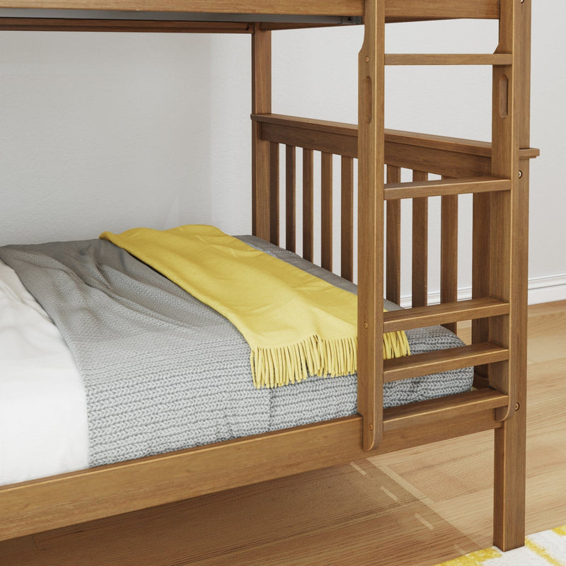 Natural wood bunk bed ladder and guardrail with gray knitted blanket and yellow throw on mattress in a modern kids' bedroom interior