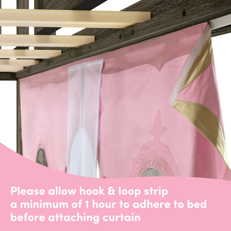 Close-up of pink princess bed canopy curtain with gold trim and sheer white panel hanging from dark wood canopy bed frame slats