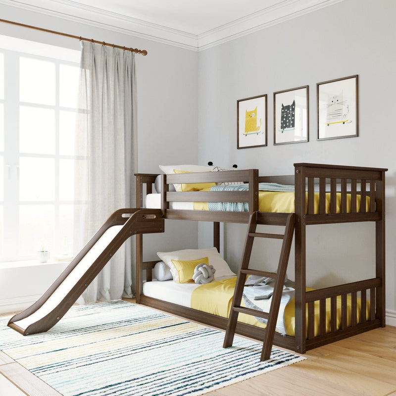 Kids wooden bunk bed with slide in bright children's bedroom with yellow bedding, striped rug, sheer curtains and framed cat wall art