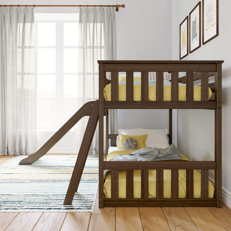 Dark wooden bunk bed with ladder in a bright children’s bedroom featuring yellow bedding, knit pillow, striped rug, sheer curtains, and framed cat prints