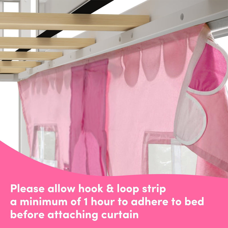 Close-up of pink bed canopy curtain hung from a white metal rail with hook-and-loop strip beneath wooden bed slats, curtain attachment and installation detail