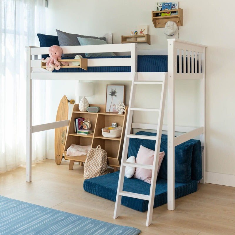 White wooden loft bed with ladder and navy bedding in a bright kids' bedroom, built-in shelves, skateboard and plush toys