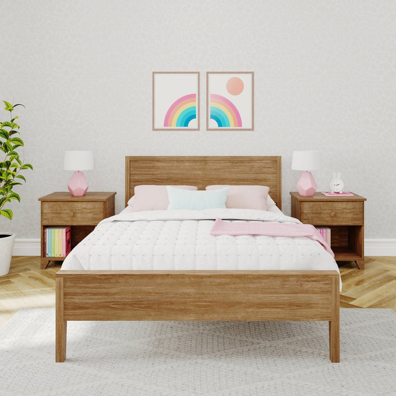 Cozy pastel kids bedroom with wooden bed, twin rainbow framed wall art, pink bedside lamps, wooden nightstands and potted plant, modern nursery decor