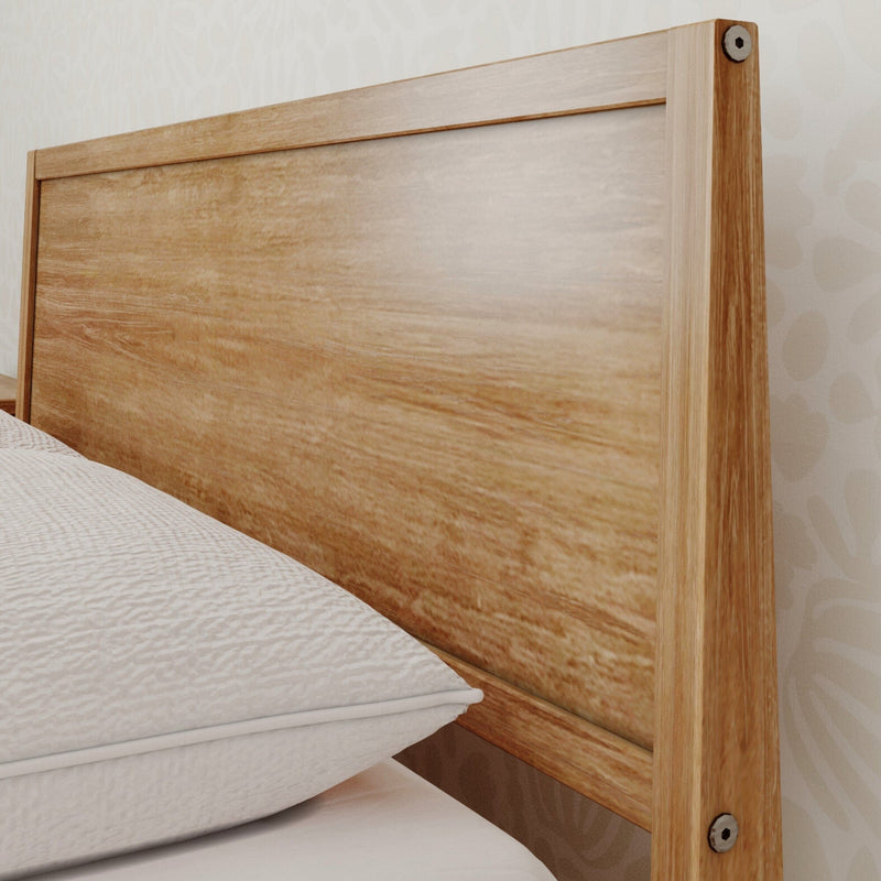 Close-up of natural solid wood bed headboard with warm wood grain, minimalist rustic bedroom decor and furniture detail