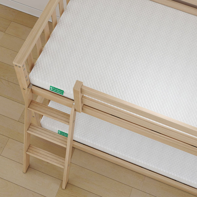 Top-down view of a natural wood bunk bed with ladder and white quilted 5-inch gel memory foam mattress on light hardwood floor
