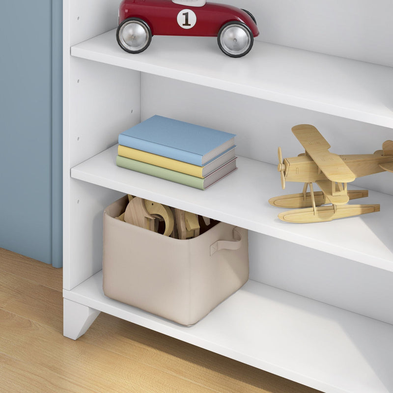 Nursery storage shelf with red vintage toy car, wooden biplanes, stacked pastel children's books and beige fabric toy bin