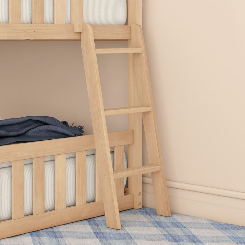Wooden bunk bed ladder close-up with natural wood rails, striped mattress, navy throw blanket and blue plaid rug against a beige wall in a kids' bedroom