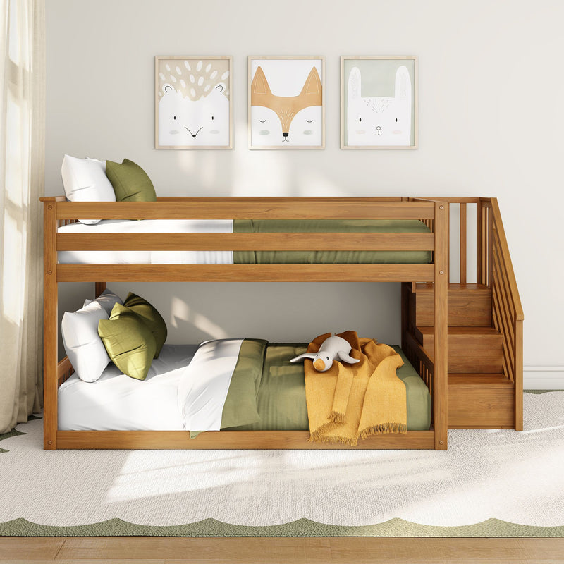 Wooden bunk bed in children's room with green bedding, mustard throw, plush toy and framed animal wall art, modern nursery decor