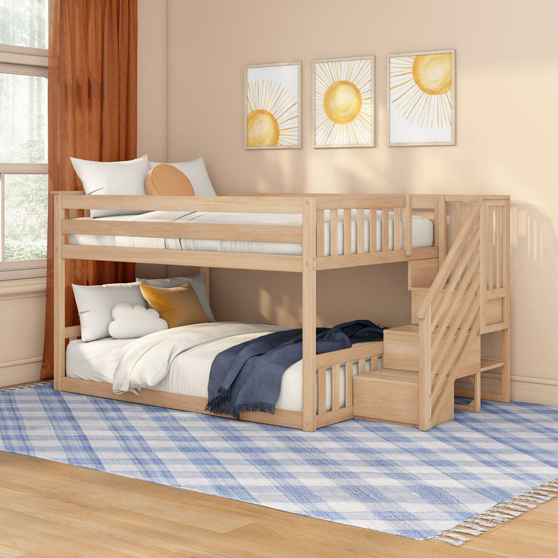 Wooden bunk bed with stairs in neutral beige kids' bedroom, sun wall art, orange curtains, blue plaid rug and cozy pillows