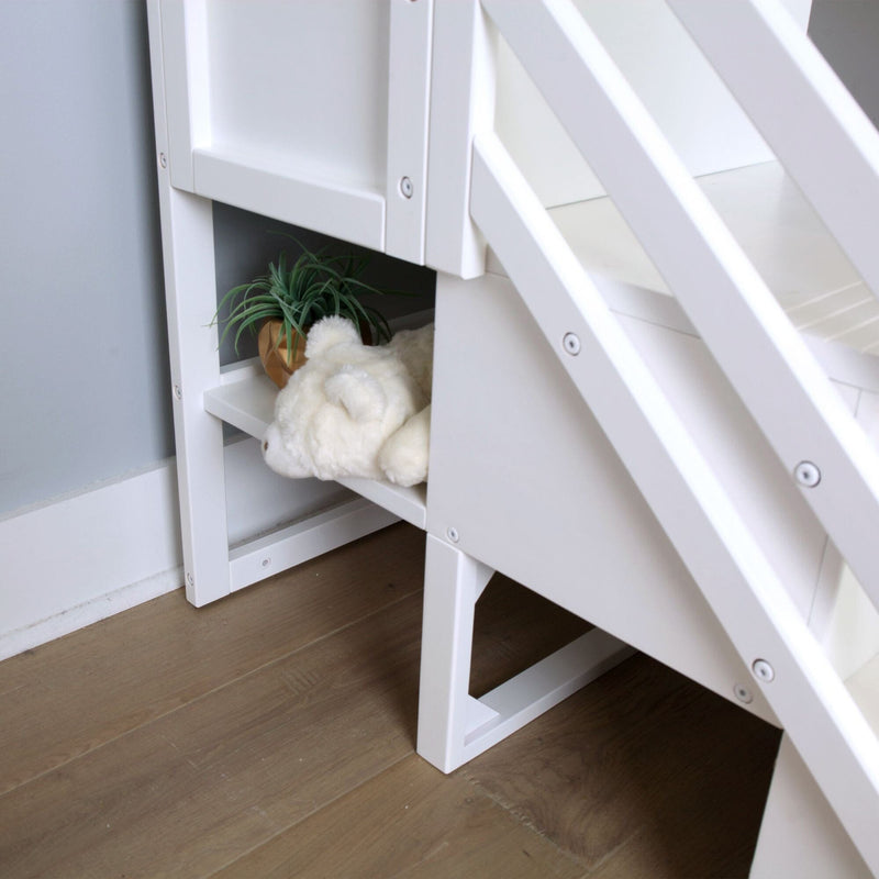 Close-up of white wooden loft bed ladder with built-in storage shelf holding a plush teddy bear and small potted plant in a modern kids' bedroom