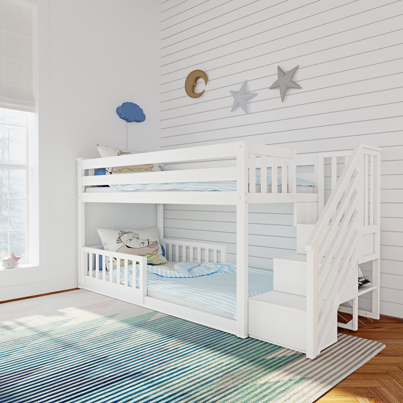 White wooden bunk bed with stairs in children's bedroom, striped blue rug, pastel bedding and moon-and-star wall decor