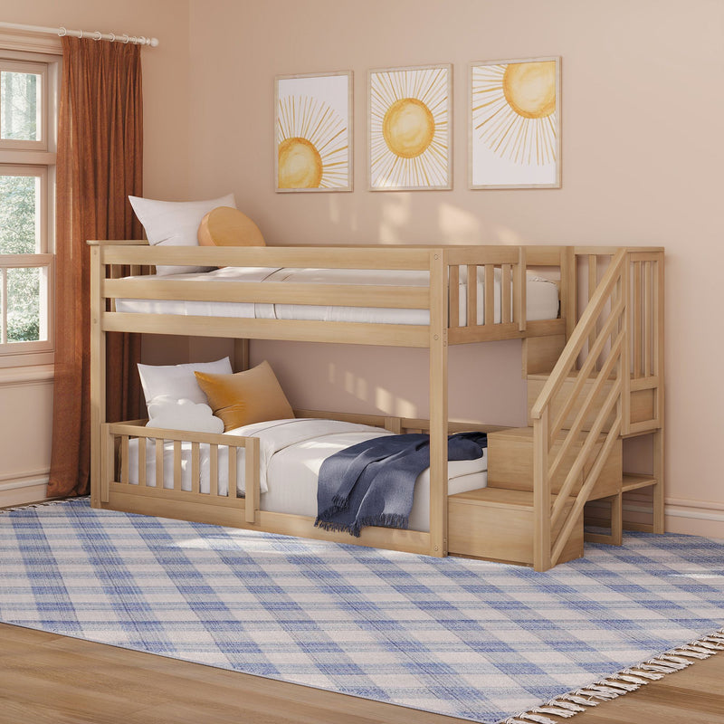 Natural wood bunk bed with stairs in a neutral kids' bedroom, featuring sun wall art, rust curtains, blue plaid rug and cozy pillows