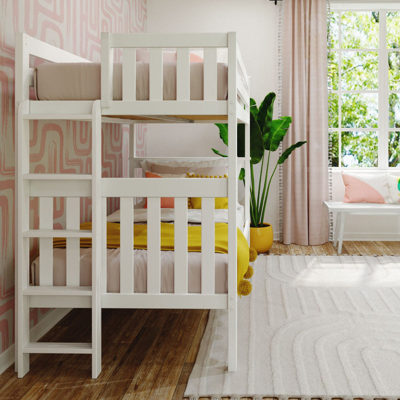 White wooden kids bunk bed in a modern pink nursery with geometric wallpaper, yellow throw blanket, ladder, potted plant and sunny window