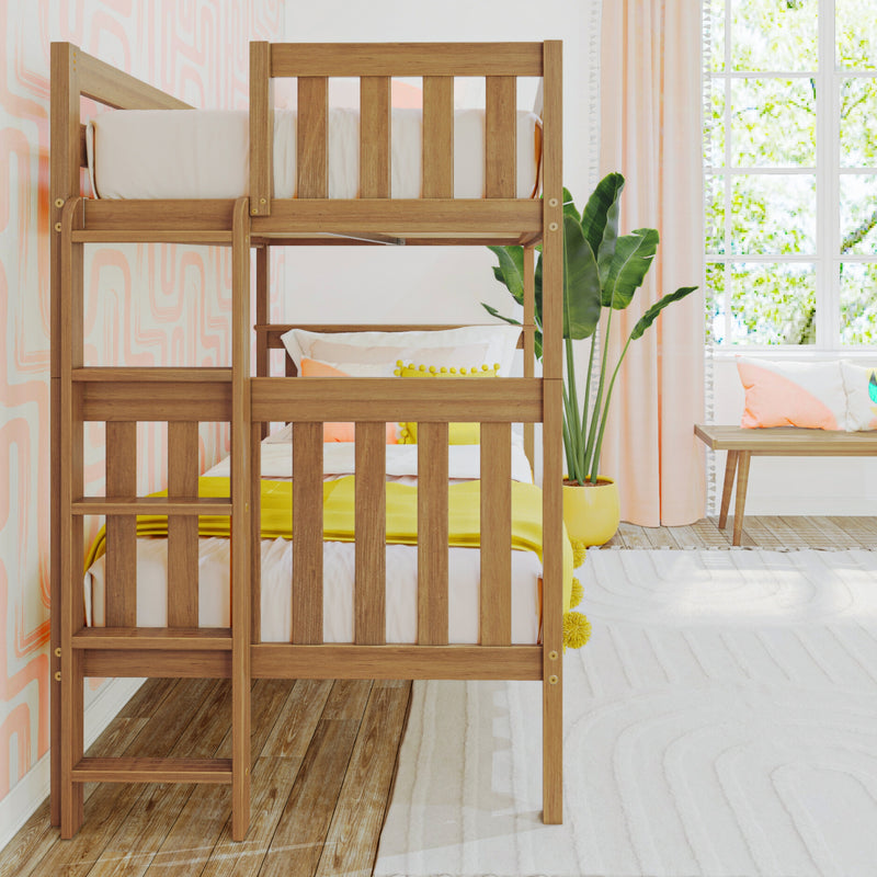 Wooden bunk bed in modern kids bedroom with pastel pink wallpaper, yellow bedding accents, potted plant and sunlit window