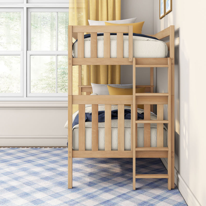 Light wood bunk bed in bright kids' bedroom with ladder, neutral bedding, yellow curtains, large window and blue plaid rug