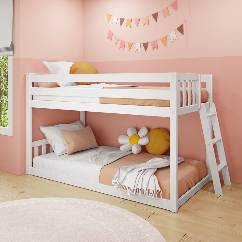 White wooden bunk bed with ladder in pink children's bedroom, peach bedding and cushions, daisy pillow, pastel bunting wall decor and light hardwood floor