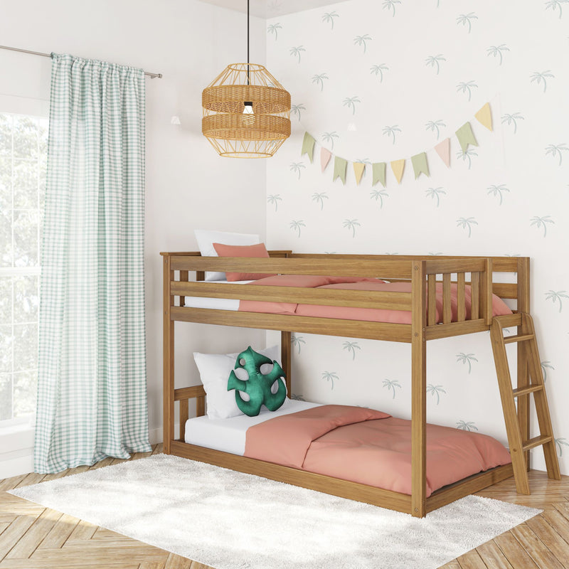 Wooden bunk bed in a kids' bedroom with coral bedding, mint gingham curtains, rattan pendant light, pastel bunting and palm-print wallpaper, modern nursery decor.
