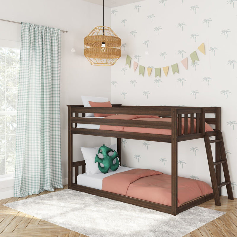 Children's dark wood bunk bed with coral bedding in a coastal nursery featuring tropical palm wallpaper, gingham curtains, rattan pendant light and pastel bunting