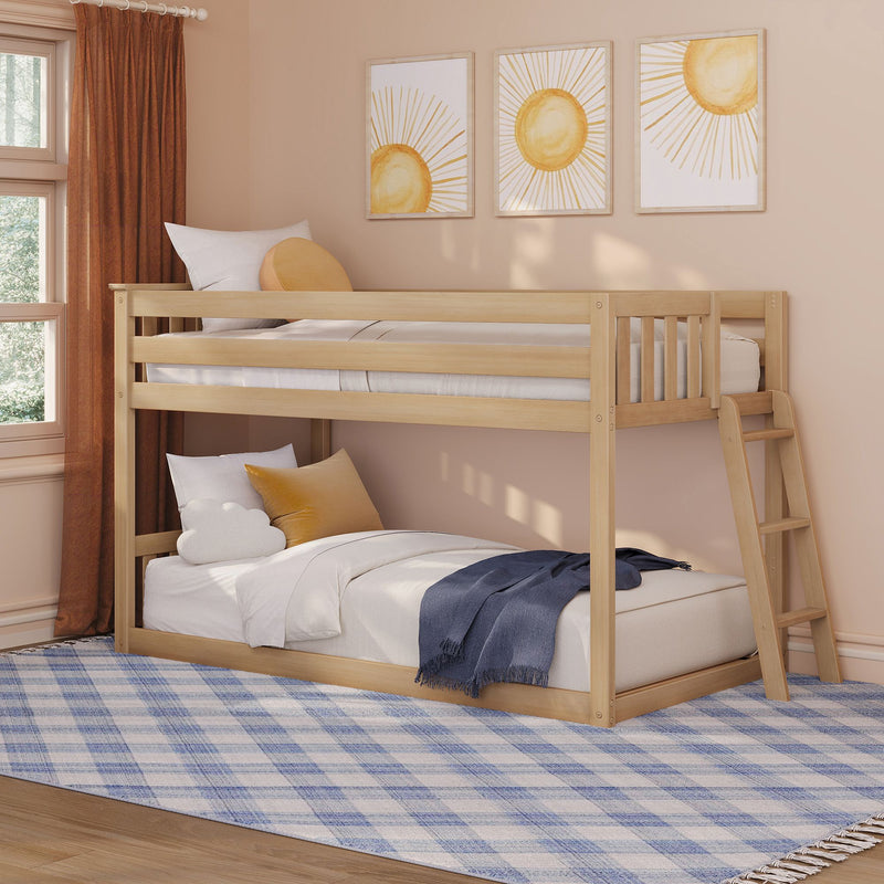 Wooden bunk bed in a cozy neutral kids' bedroom with beige walls, terracotta curtains, sun-themed wall art, ladder, soft pillows and blue plaid rug