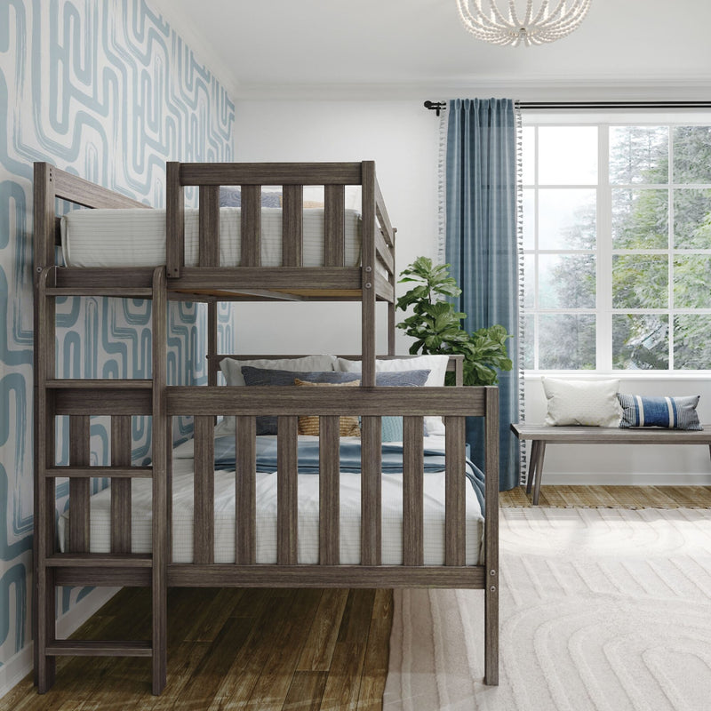 Modern kids' bedroom with gray wooden bunk bed, blue geometric wallpaper, large window with blue curtains, cozy bench and houseplant